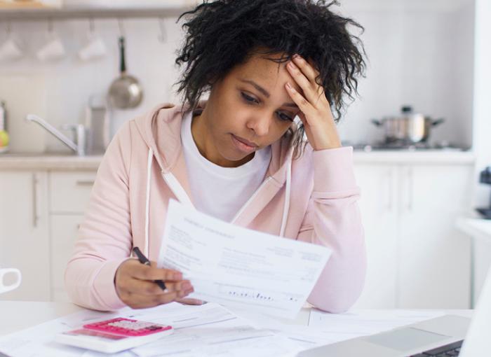 woman reading bill